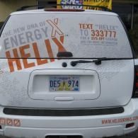White van rear with “Energy X Helix” and “Text ‘Helix’ to 333777” advertising on the back