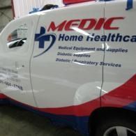 White MEDIC Home Healthcare van with red and blue logo and service text on the side.