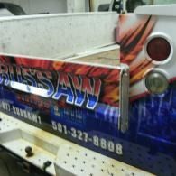 Colorful truck side panel with “RUSSAW” logo, paint graphic, and phone number 501-327-8808.