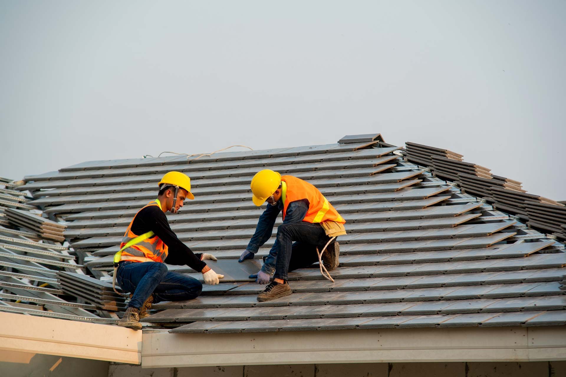Roofer worker Installing new roof. Roofer worker Installing new roof.