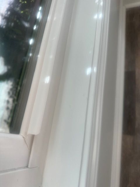 White window frame detail, showcasing a close-up view of the trim and corner.