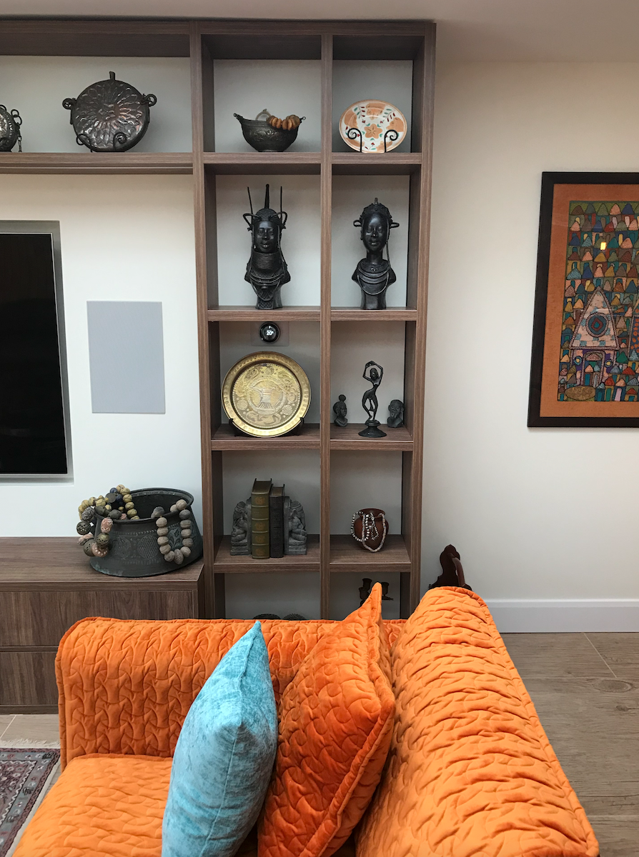 Case study of open-plan living room and dining room. The colour scheme is tangerine and teal.
