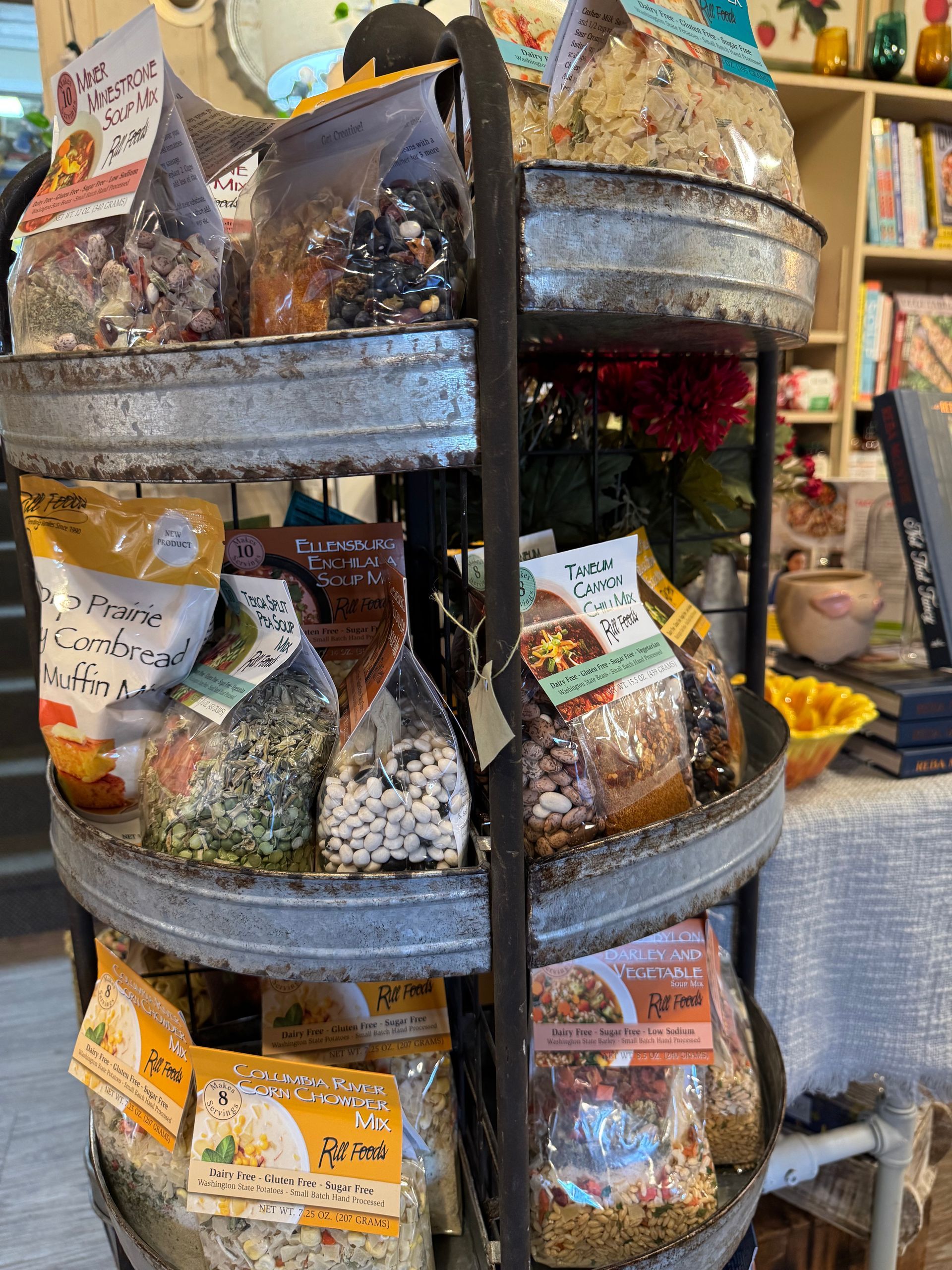 A display of bags of food on a shelf in a store.