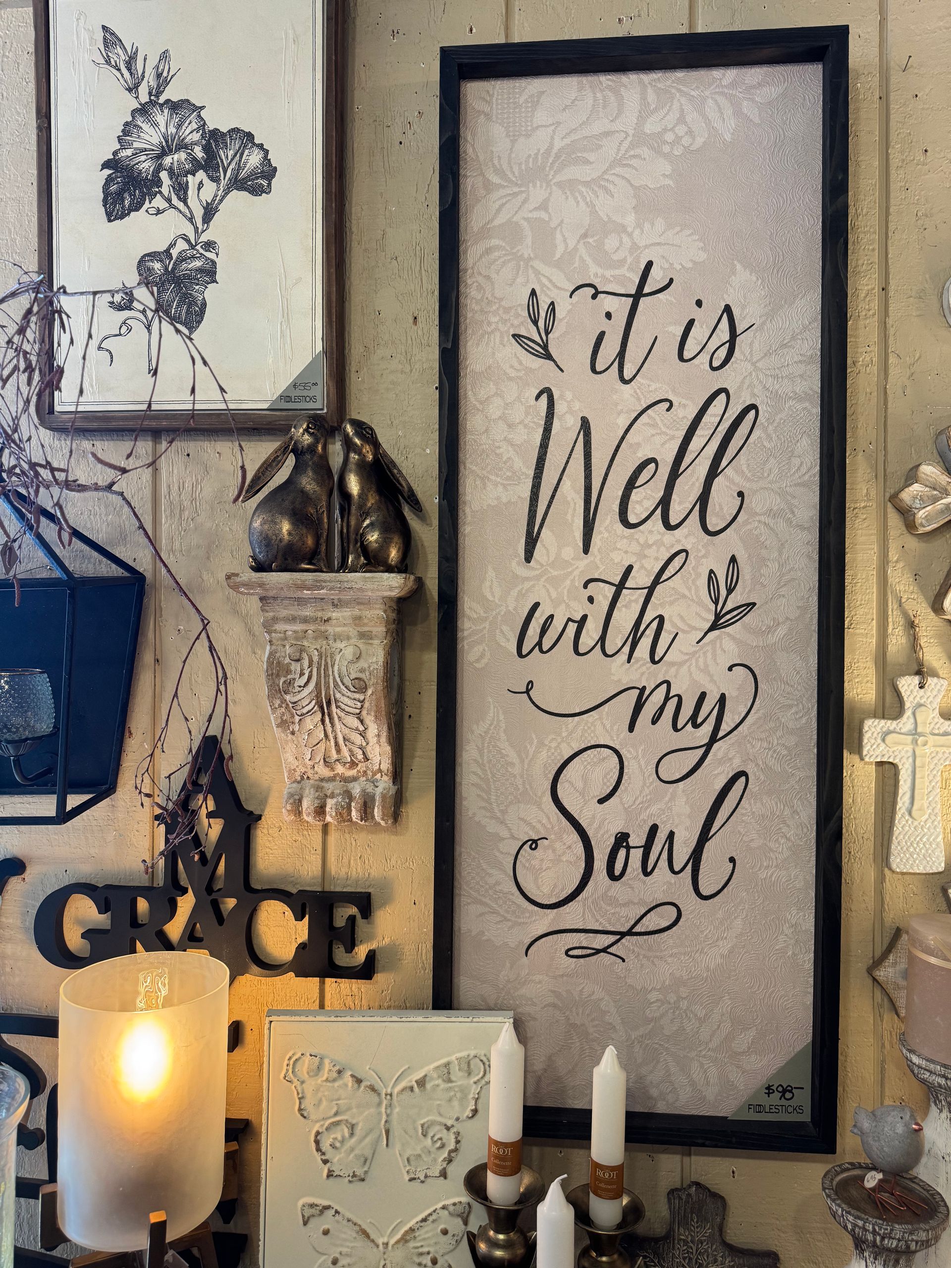 A sign on a wall that says `` it is well with my soul ''