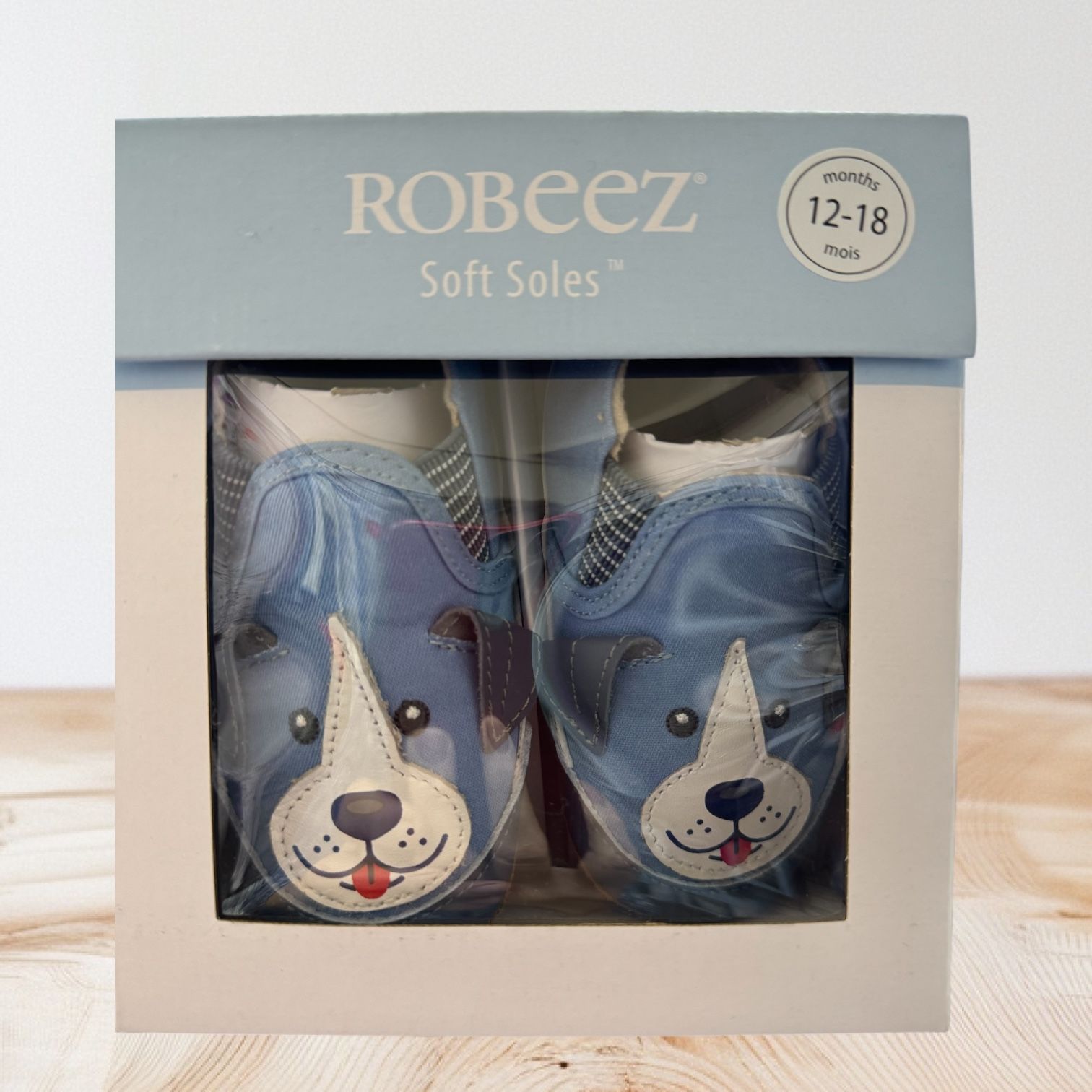 A pair of robeez soft soles in a box