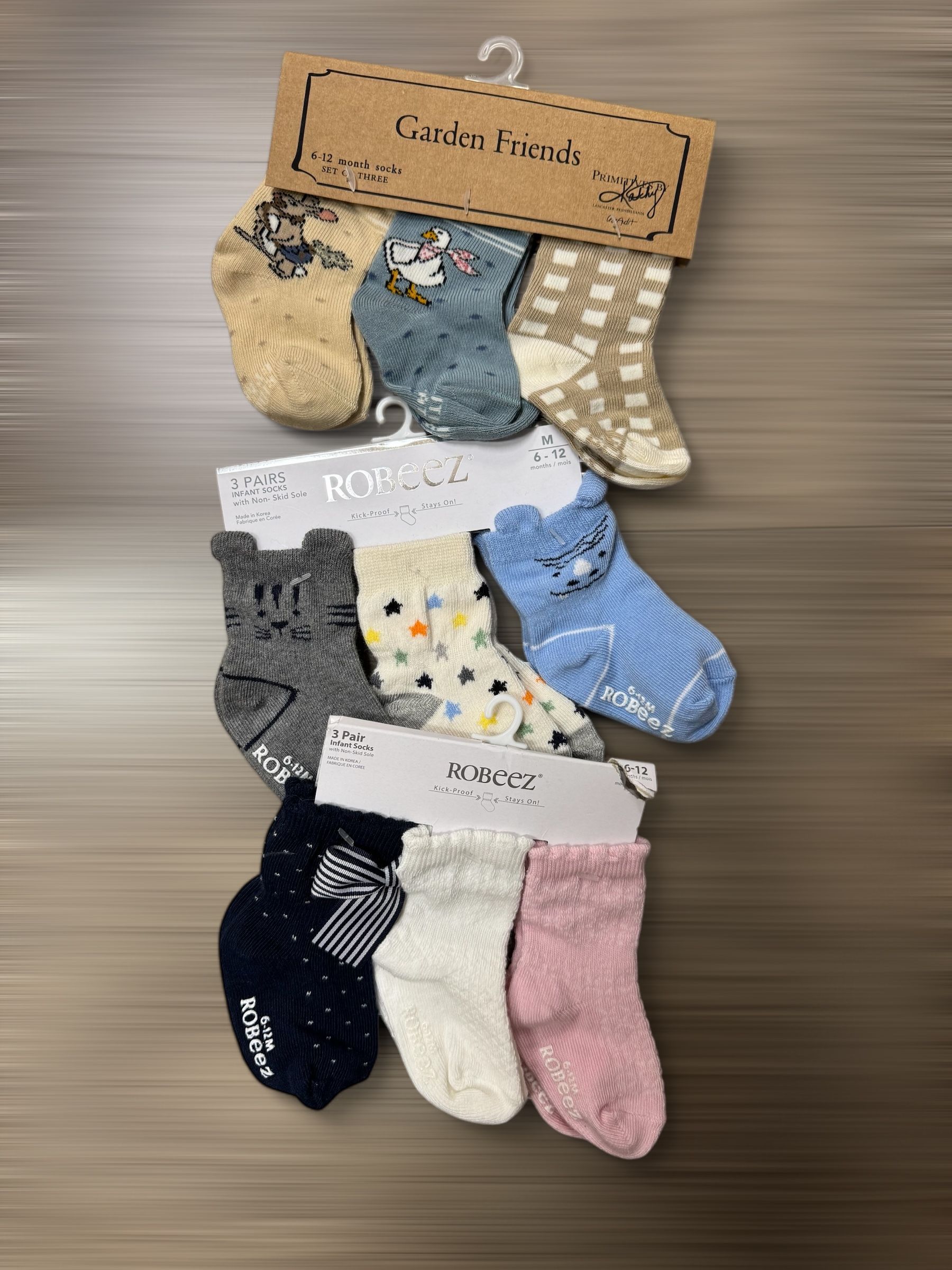 A bunch of socks are hanging on a hanger on a table.