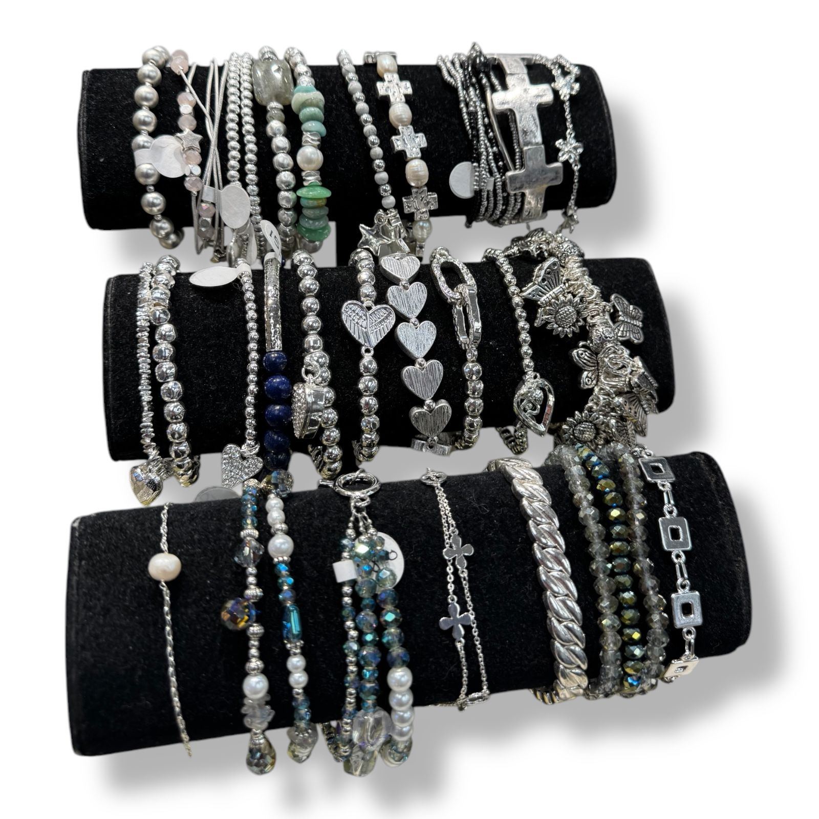 A bunch of bracelets are stacked on top of each other