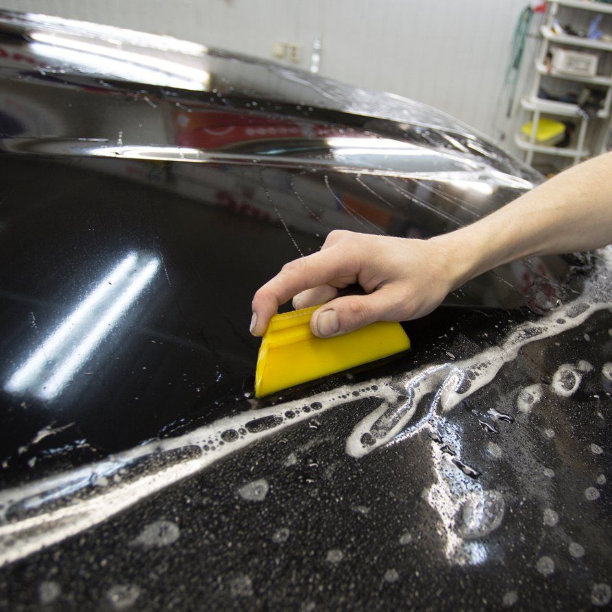 Close Up Photo Of Paint Protection Installation —  Lombard, IL — X-Treme Graphics & Lettering Inc
