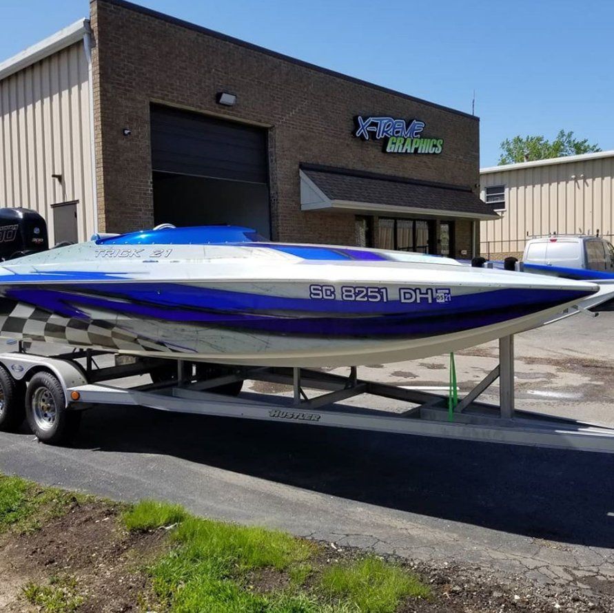 Close Up Photo Of A Boat With Lettering — Lombard, IL — X-Treme Graphics & Lettering Inc