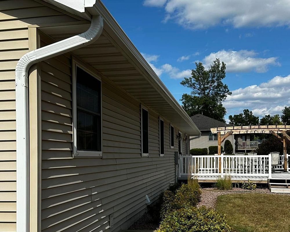 A house with a gutter on the side of it