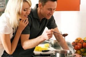 man and woman at making dinner