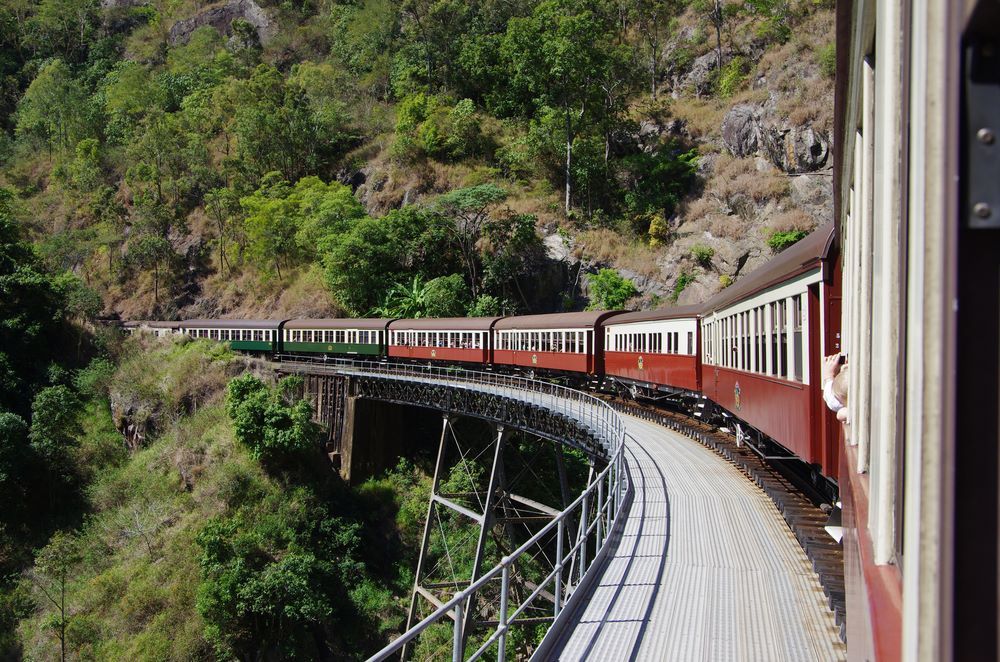 A Train is Going Over a Bridge in the Mountains — Supportability Care Services in West Rockhampton, QLD