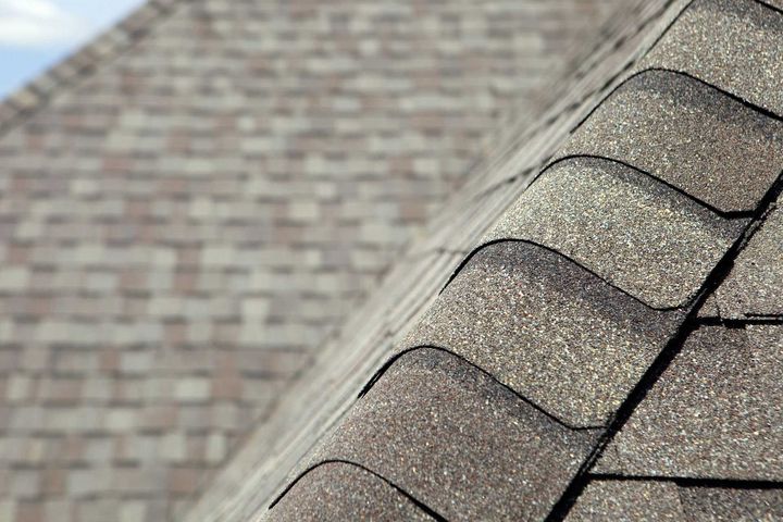 Man Installing Asphalt Roof — Kirkwood, MO — FM Roofing