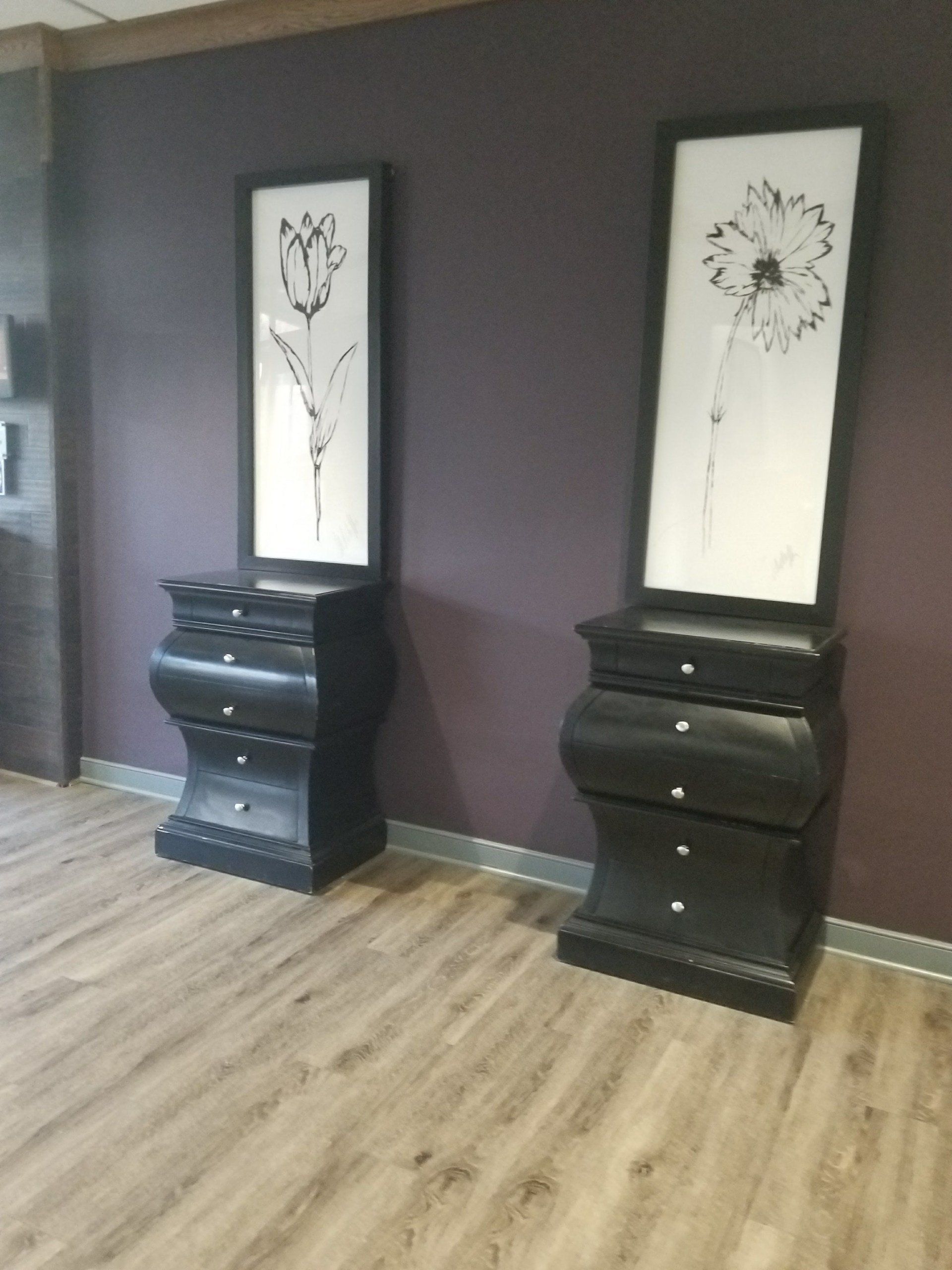 japanese style monochrome flowers of a rose and a daisy above a curvy nightstand  by dismantle furniture