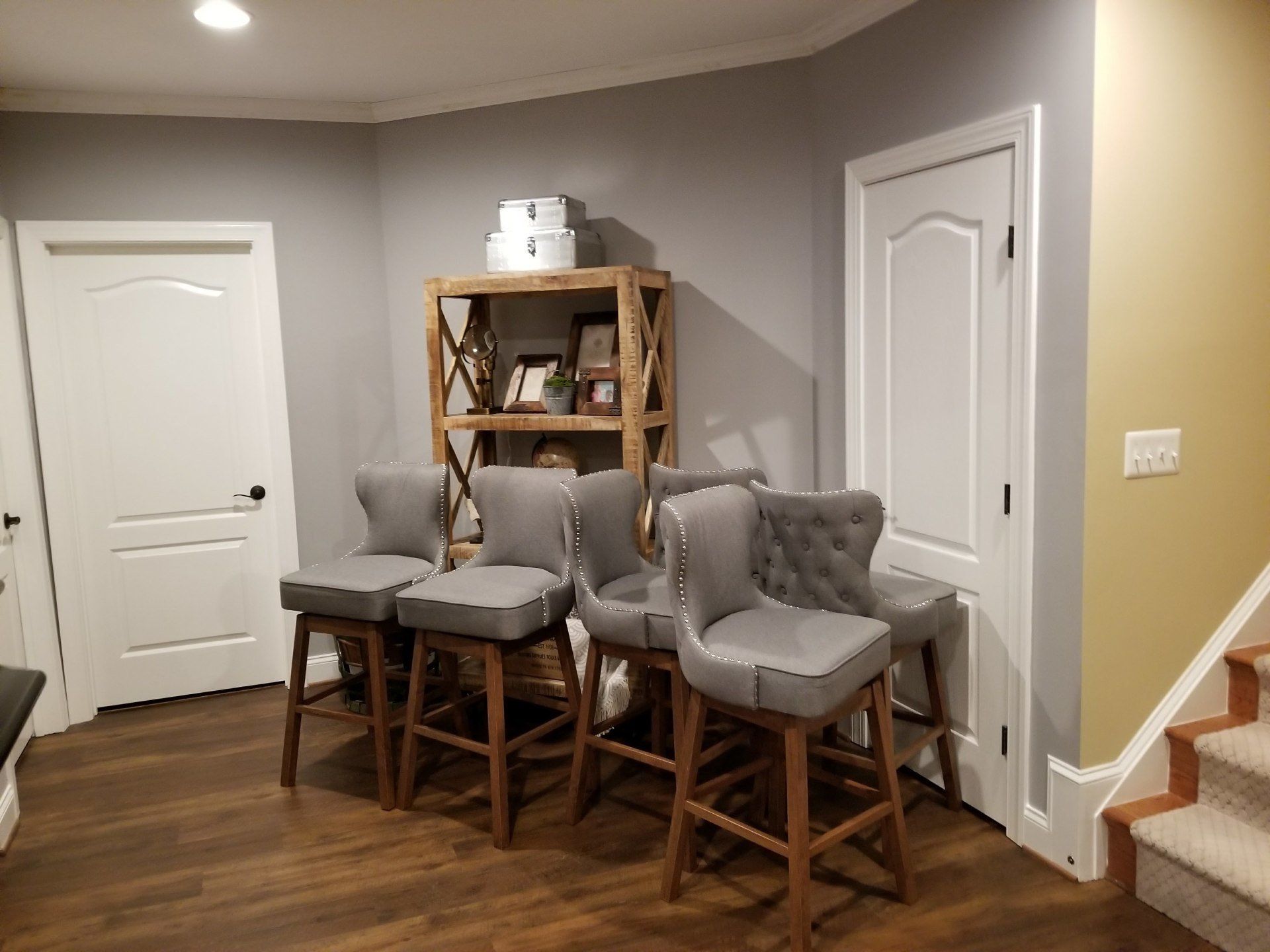 cloth grey high chairs and a barn style cabinet by furniture assembly team