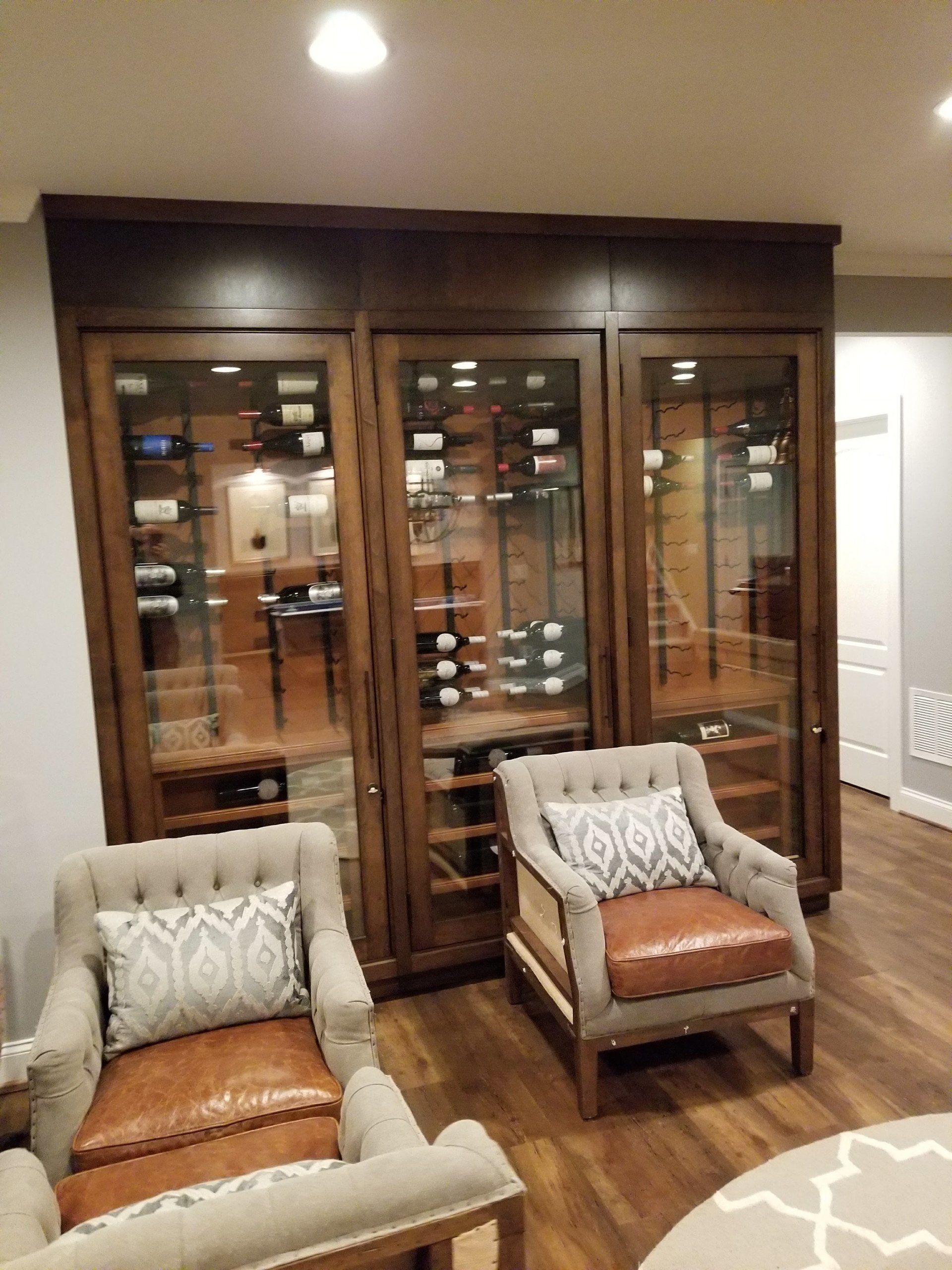 wooden oak glass wine cabinet with cloth eazy chairs and cushions by furniture assembly team