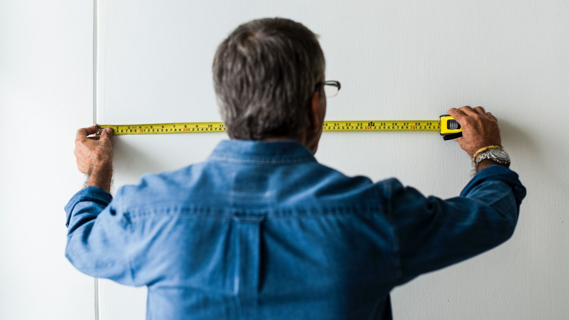 a man with a measure tape