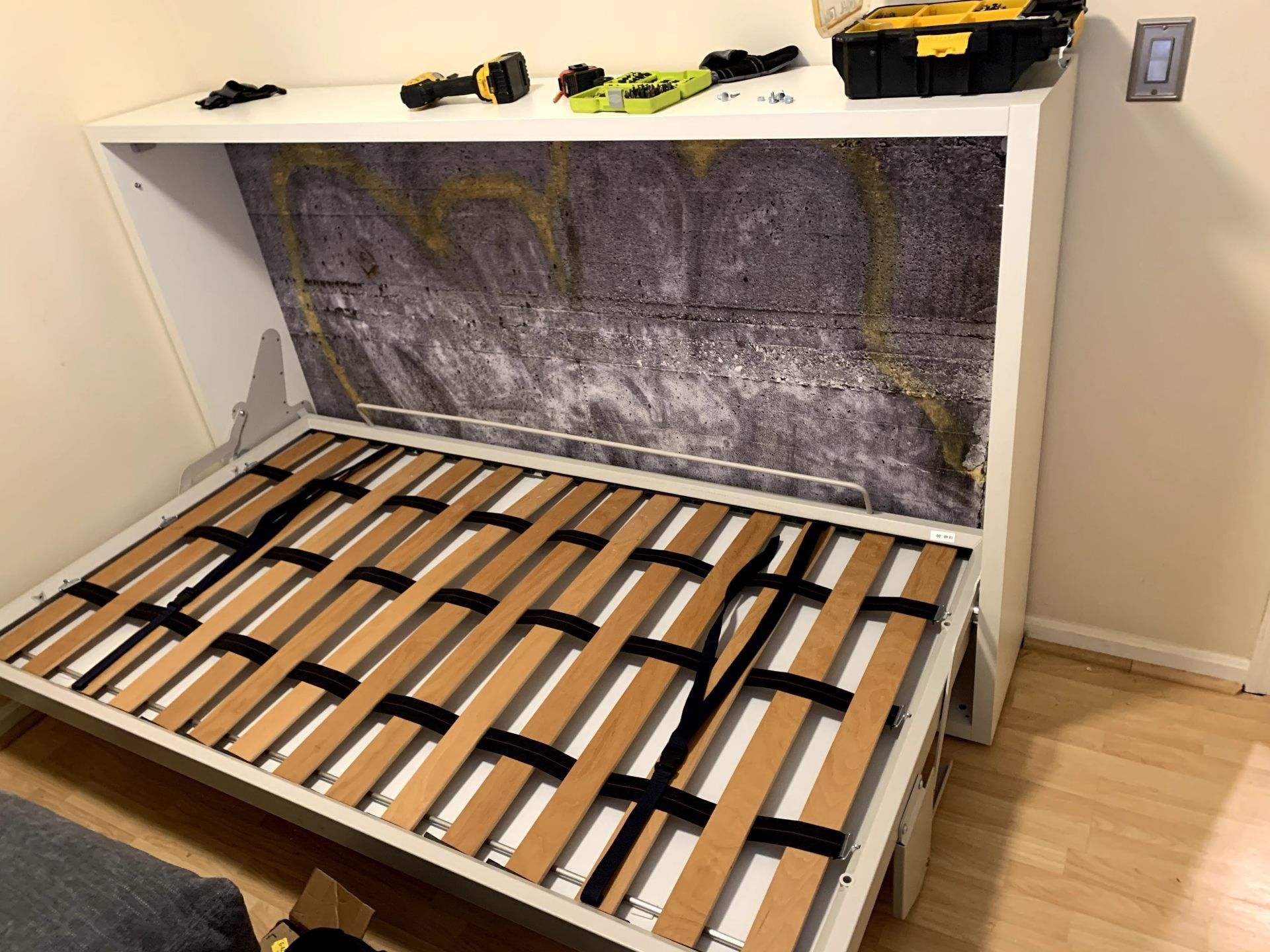 parofile view of assembled red velvet slate pool table with pool cues  by furniture assembly team