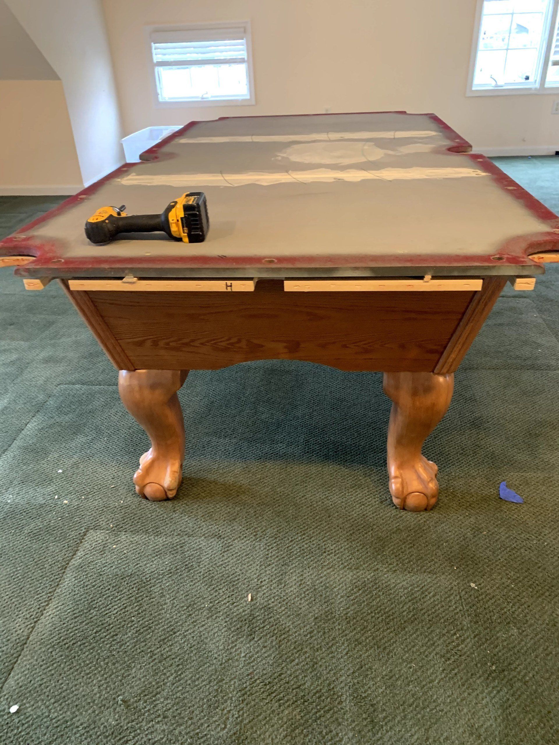 assembling a 7 foot slate pool table by furniture assembly team