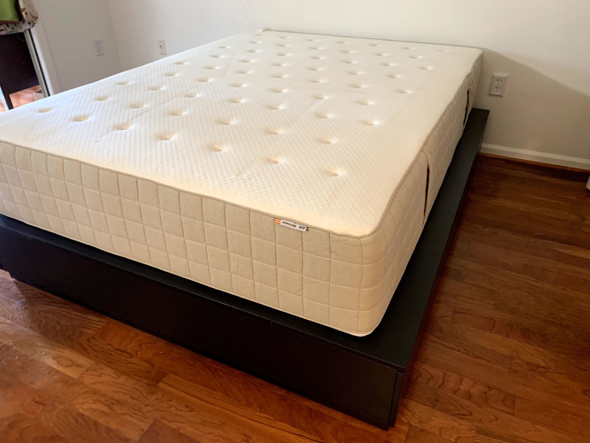 IKEA Nordli bed in black with a white mattress by furniture assembly team