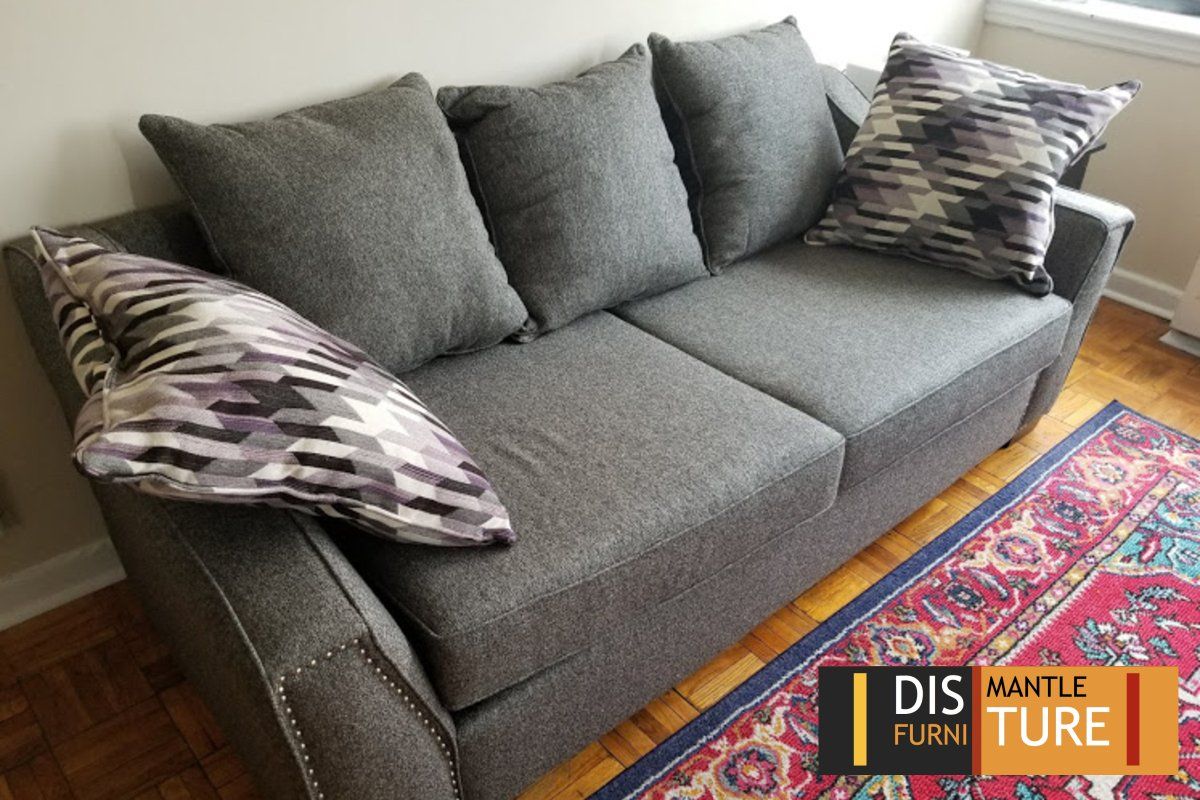 Grey fabric sofa disassembled by Dismantle Furniture Company