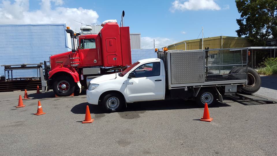 Red Trailer Truck and White Pickup — Your Local Tyre Shop in Gladstone, QLD