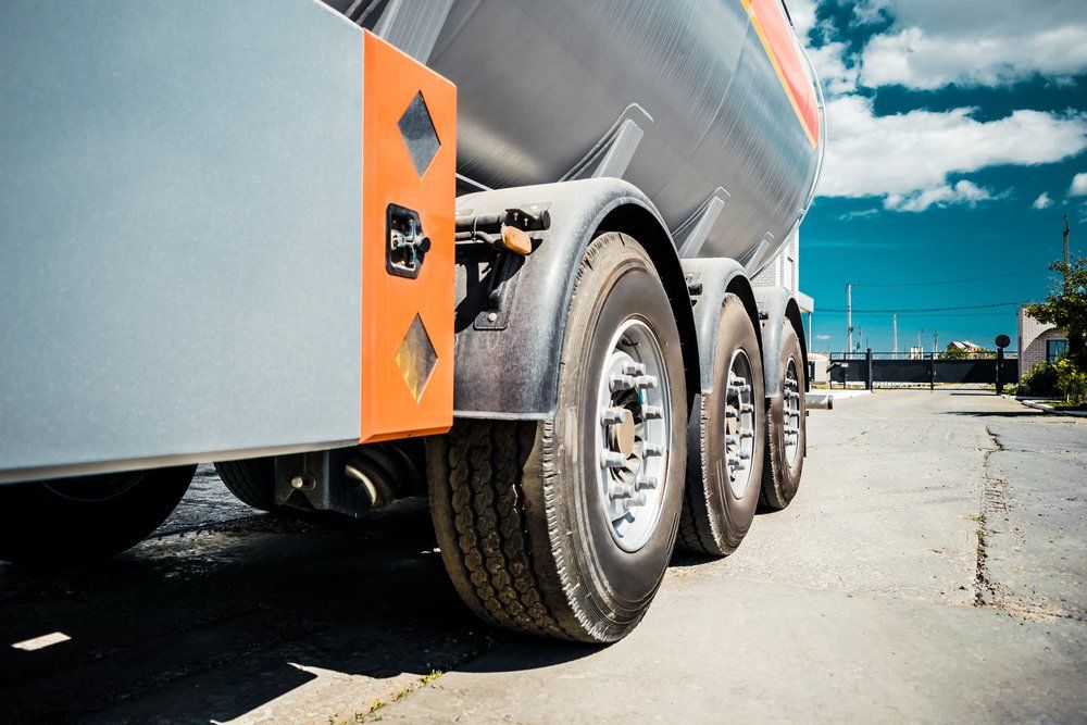 Truck With Trailer, Tank With Flammable Liquid, Sunny Day Outside — Sturdy Large Truck Tyres in Gladstone, QLD