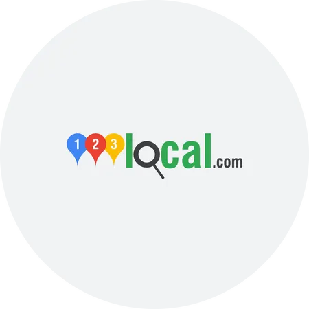 The logo for local.com is in a circle on a white background.