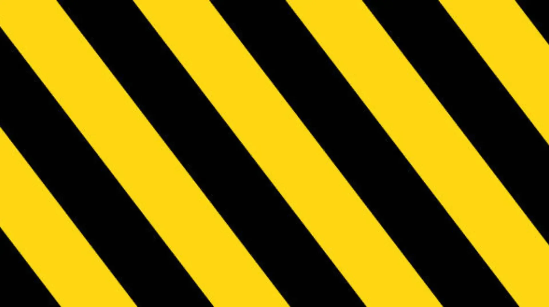 A close up of a black and yellow striped background.