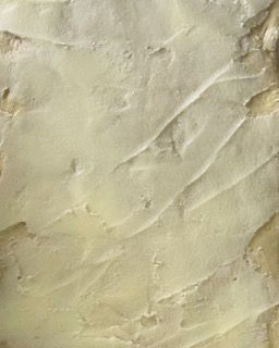 Un primo piano di un pezzo di carta che sembra una trama di marmo.