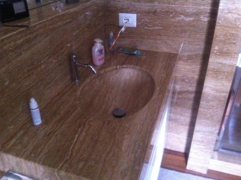 brown stone top with recessed basin