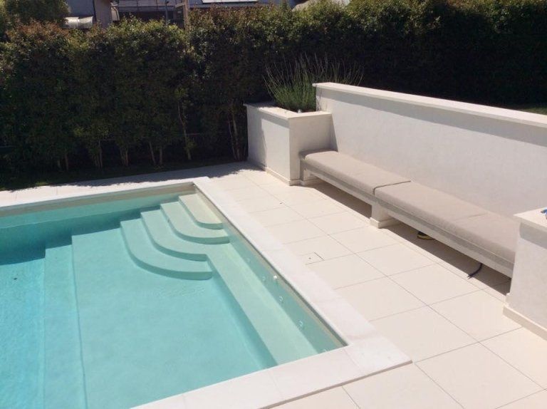 outdoor swimming pool with natural stone surfaces
