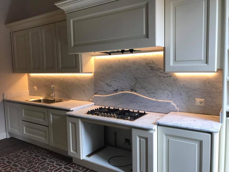 kitchen with white marble top and splashback
