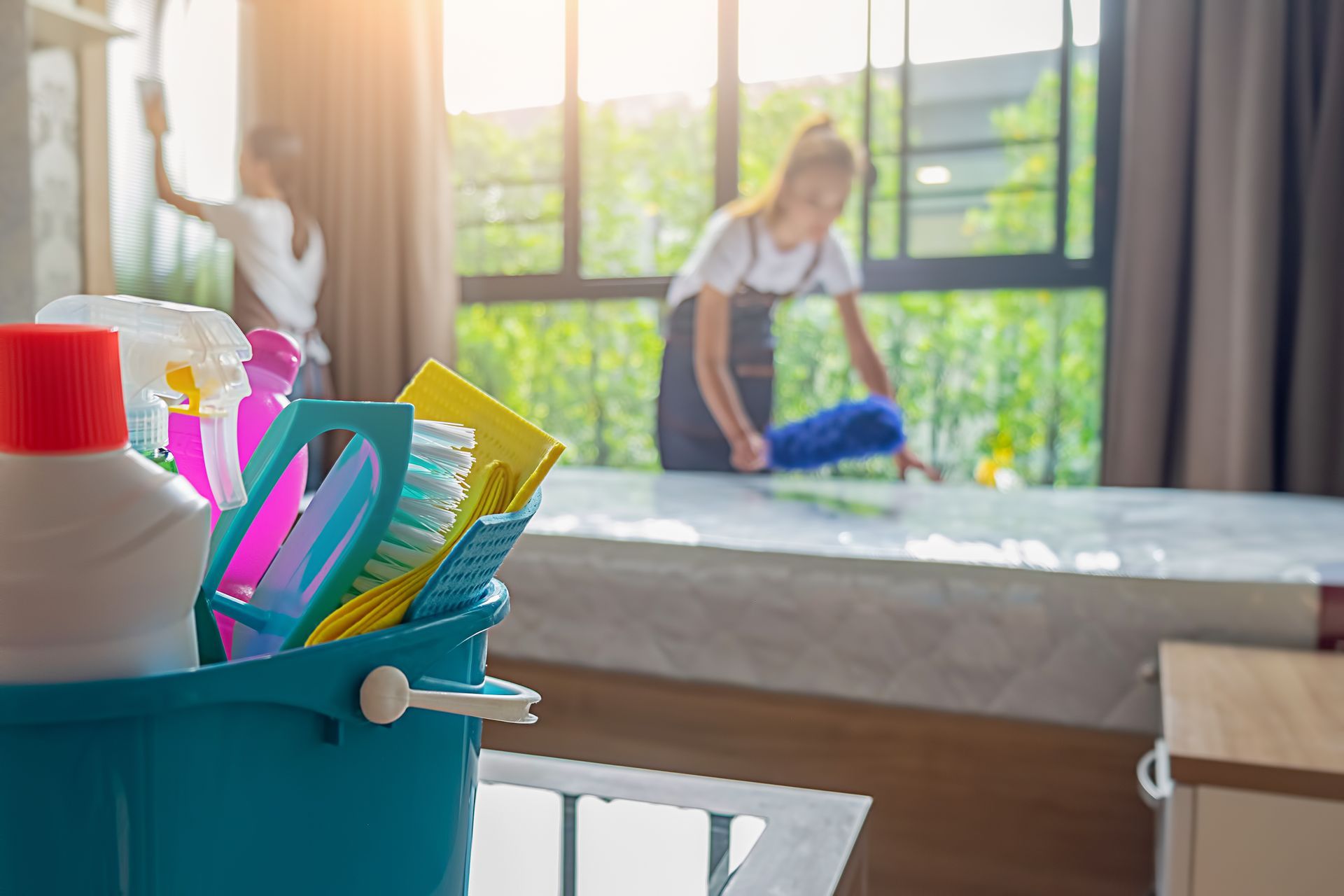 Cleaning a room with cleaning supplies.