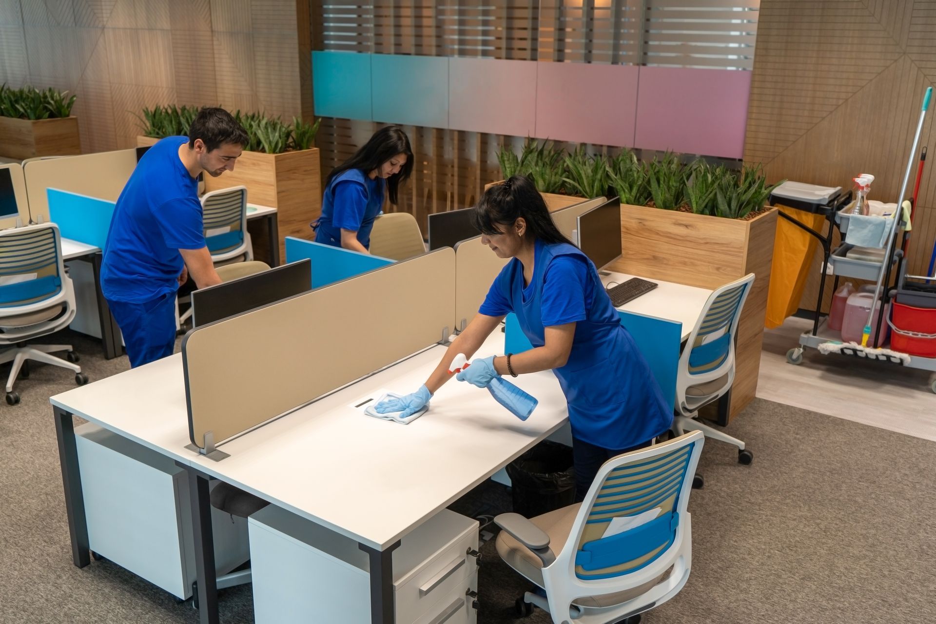 Cleaning a desk in an office.