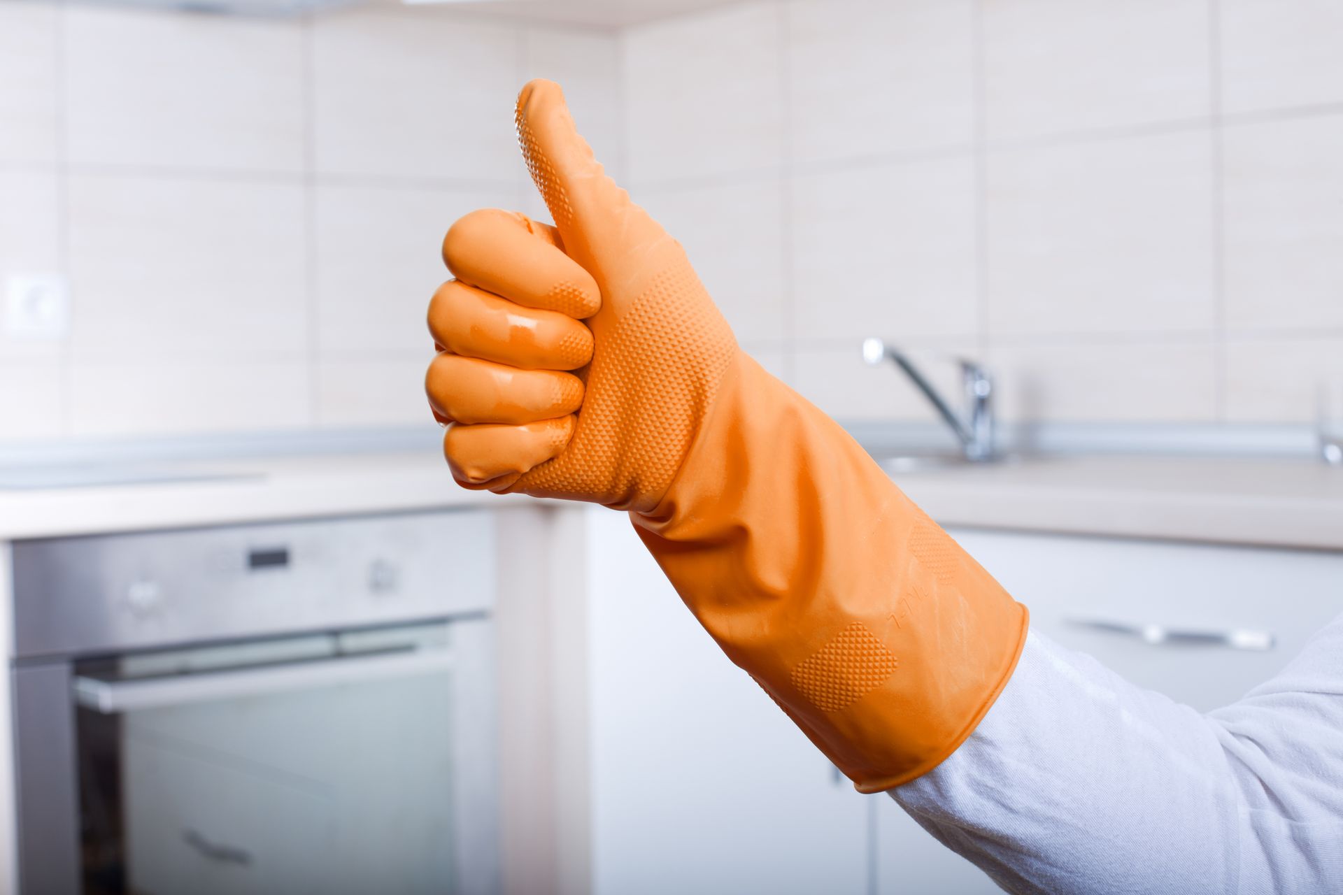 Wearing cleaning glove.
