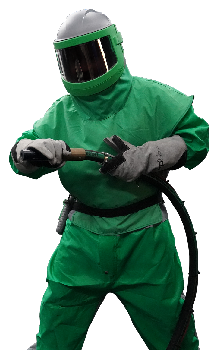 A man in a green suit and helmet is holding a hose