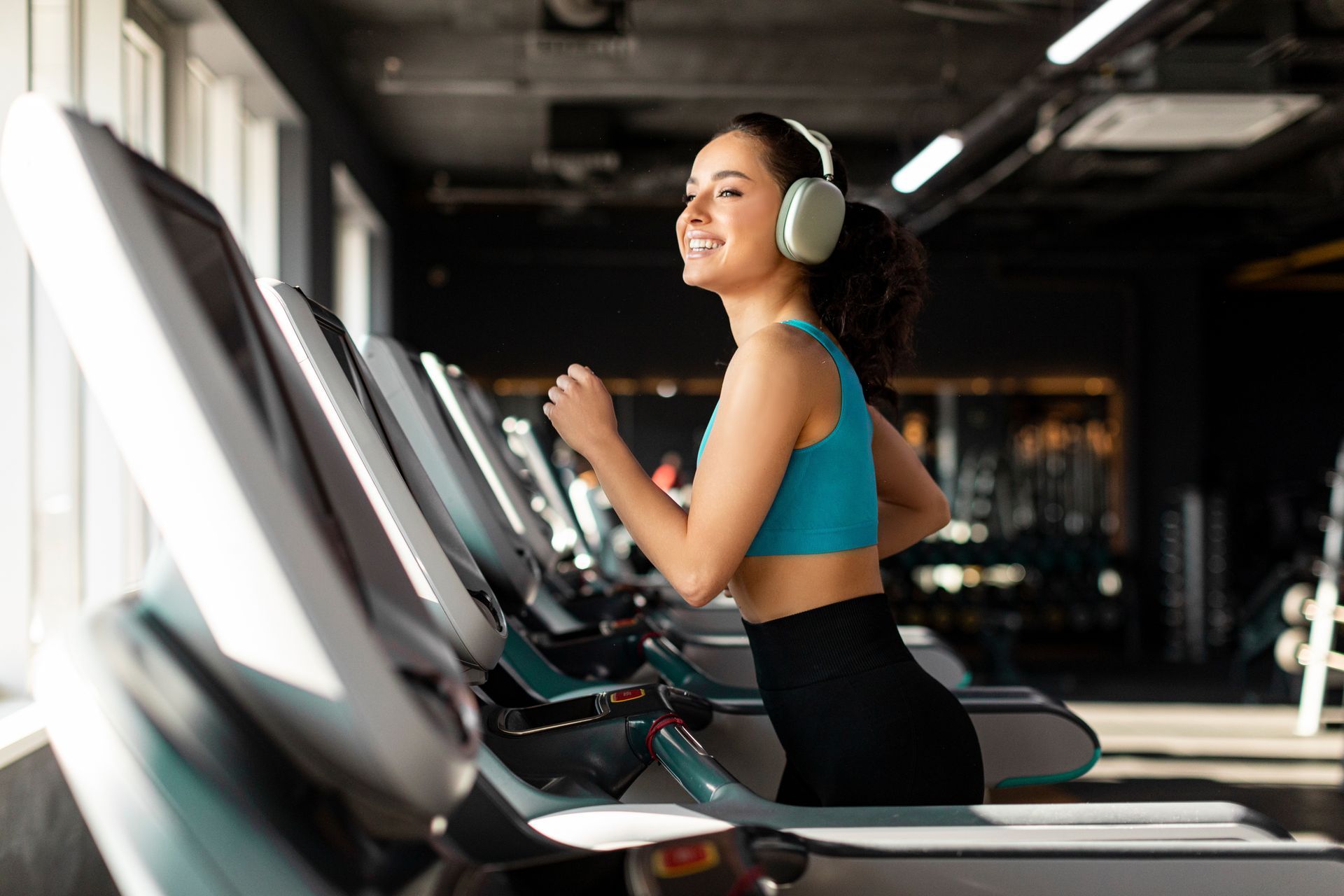 Running on a treadmill in a gym