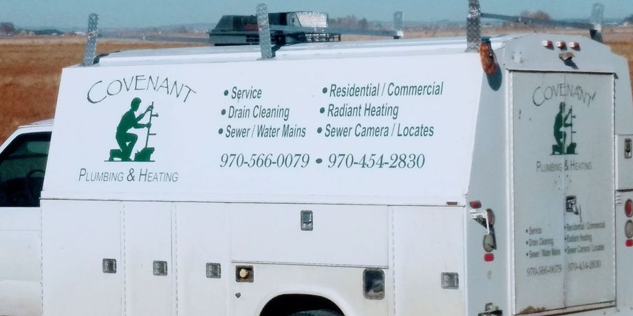 Ben, the plumber, standing next to his work van