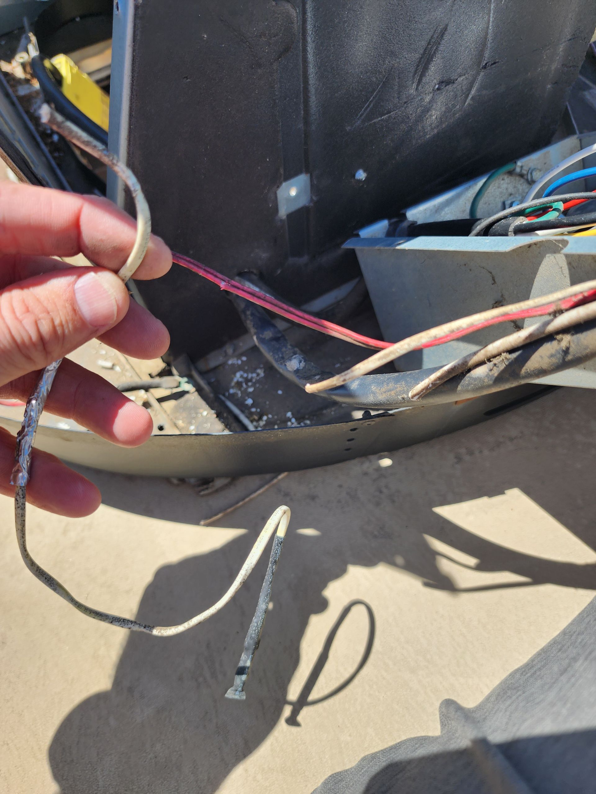 A person is holding a bunch of wires in their hand