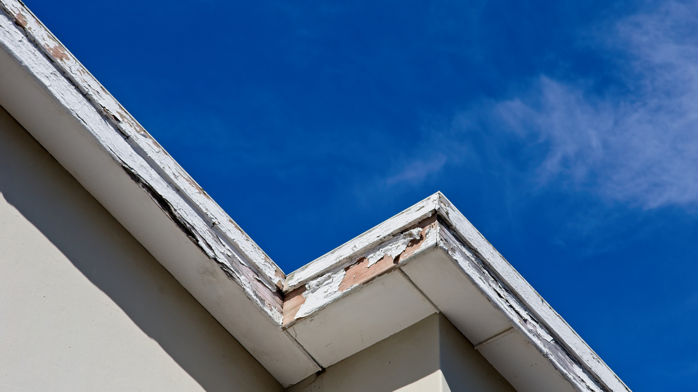 A close up of a roof with a blue sky in the background.