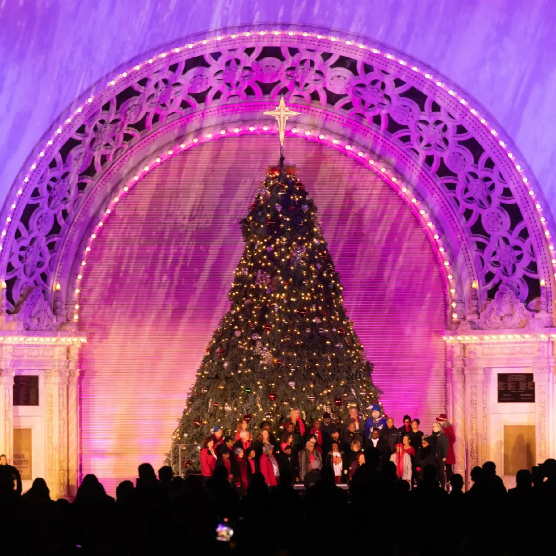 Crowds enjoying December Nights in Balboa Park on a charter bus outing