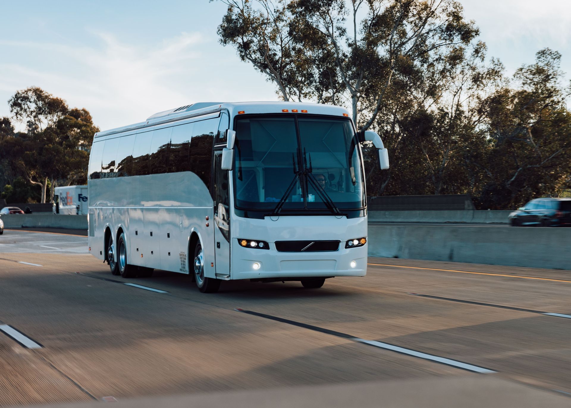 Charter bus cruising with a happy group headed to a concert festival in San Diego