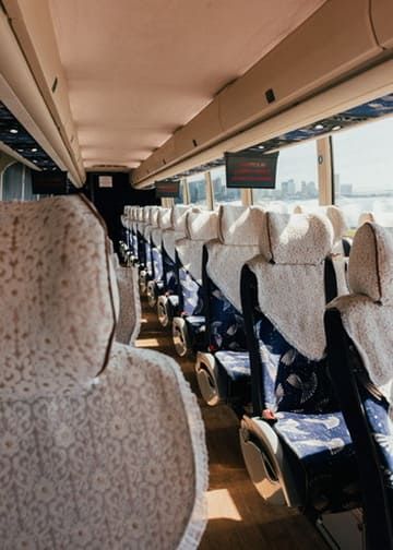 comfortable seats inside charter bus for group travel in San Diego