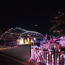 Holiday house lights at Jingle Bell Hill in El Cajon on a group tour