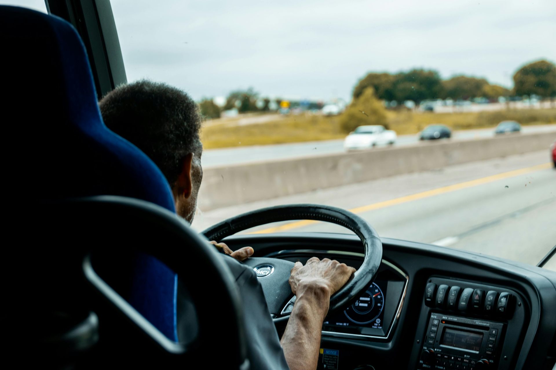 Charter bus driver navigating safely during a group trip in San Diego