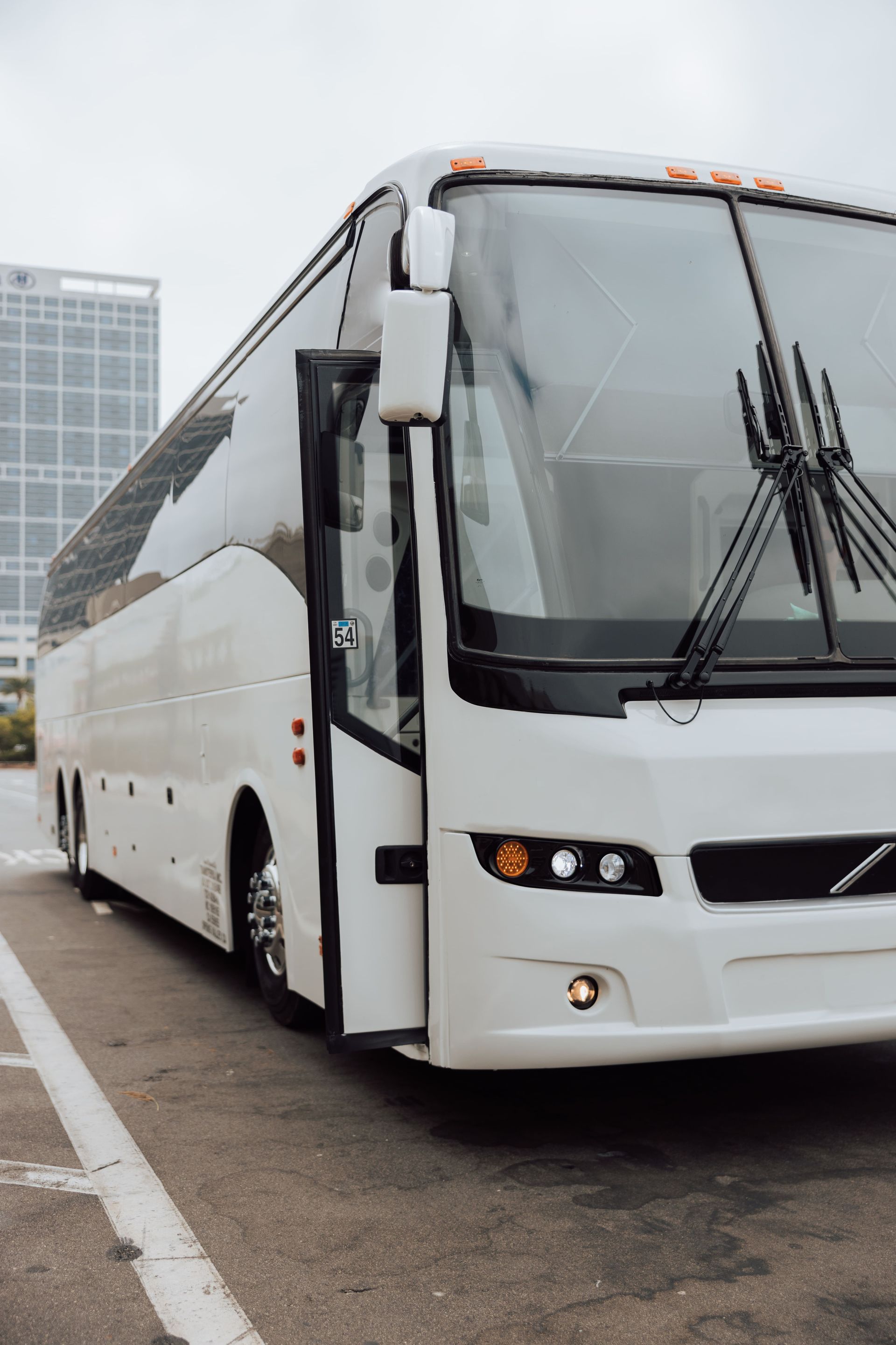 Charter bus transporting a group of travelers on a scenic San Diego route