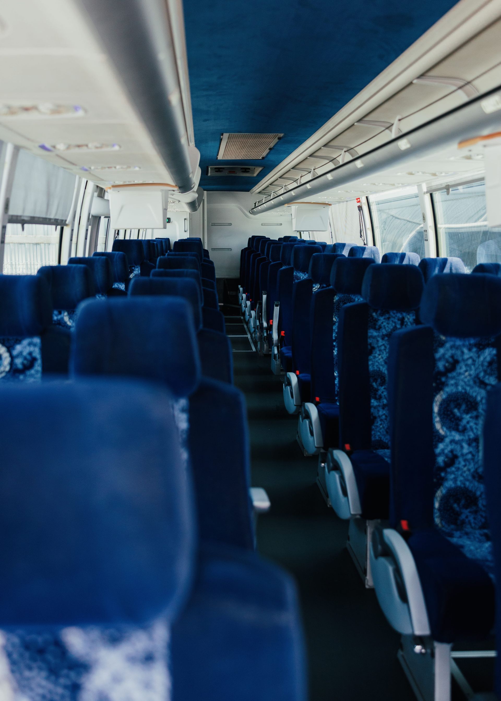 Spacious seating arrangement inside a San Diego charter bus rental for comfort and convenience.