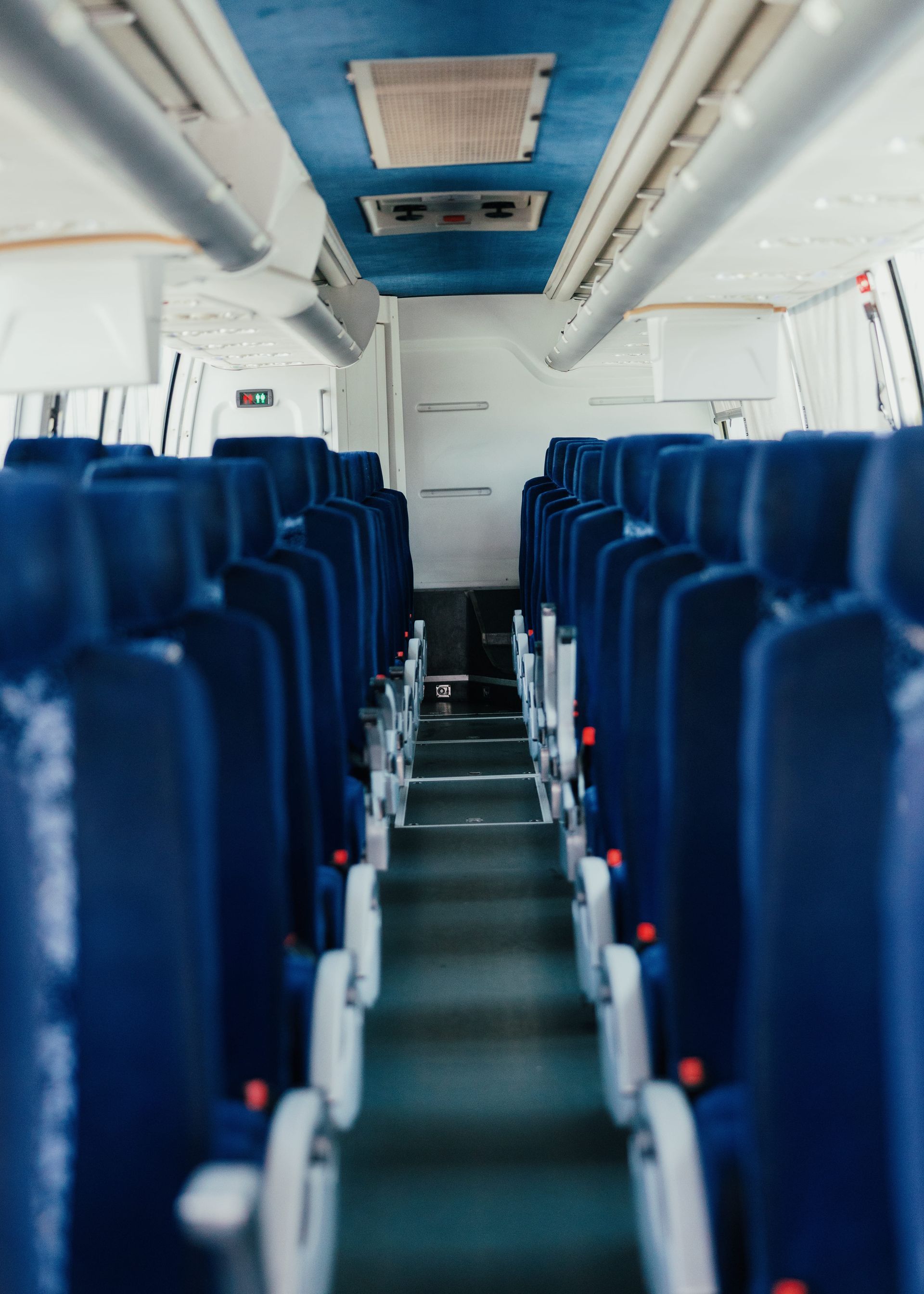Interior view of a San Diego charter bus showing comfortable seats for group travel.