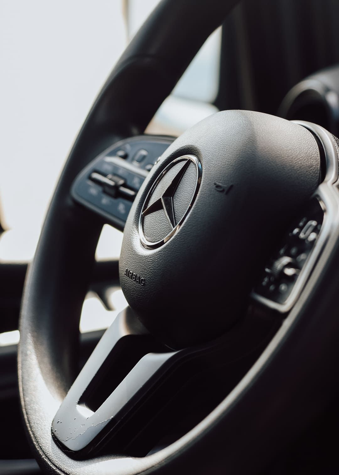 Steering wheel closeup inside sprinter van rental San Diego